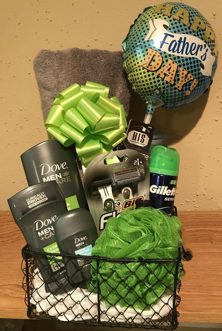 a gift basket filled with groom's products and a father's day ball