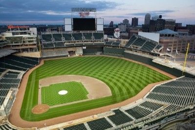 an aerial view of a baseball stadium with the city in the background