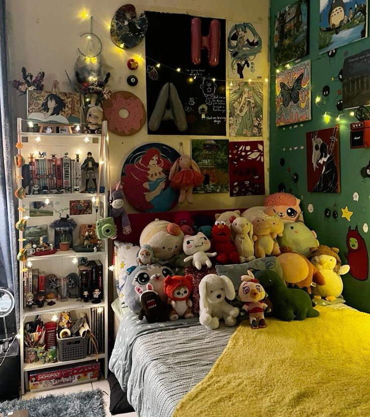 a bed with lots of stuffed animals on it in a room filled with posters and lights