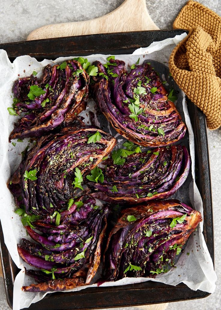 grilled red cabbage with herbs in a baking pan