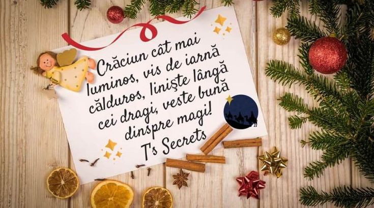 a christmas message written in spanish on a piece of paper surrounded by orange slices and cinnamons