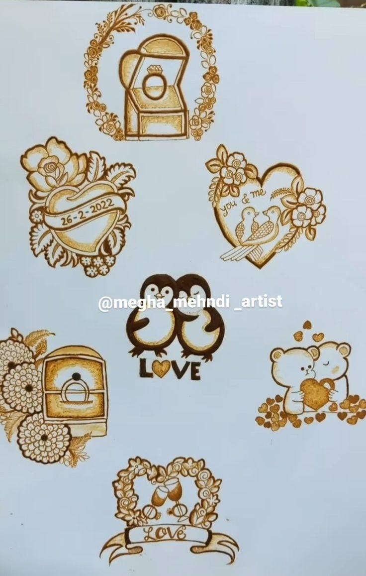 some gold and white stickers with hearts