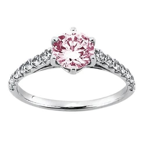 a pink diamond ring with white diamonds on the sides and an accent band around it