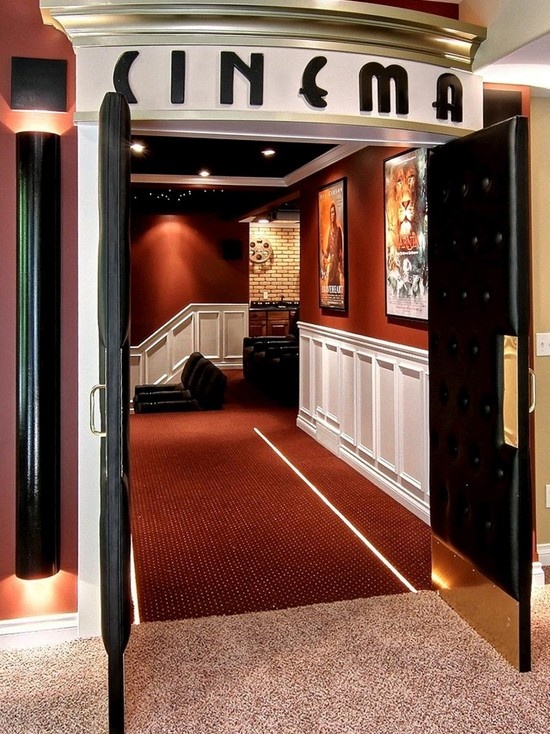 an open door leading to a room with red carpet and white trim on the walls