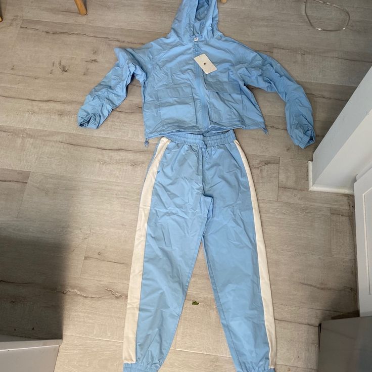 New With Tags! Jacket Is S And Pants Are Xs Blue Spring Tracksuit Sportswear, Sporty Blue Tracksuit For Spring, Sporty Spring Tracksuit With Pockets, Blue Athleisure Tracksuit For Loungewear, Light Blue Athleisure Activewear For Spring, Spring Athleisure Light Blue Activewear, Light Blue Spring Athleisure Activewear, Blue Spring Tracksuit For Streetwear, Blue Fitted Tracksuit With Pockets