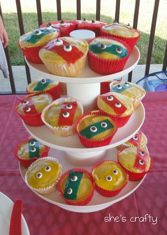 cupcakes and muffins are displayed on three tiered tray