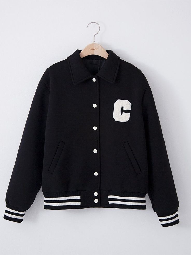 Chic classic style bomber stadium jacket with contrast striped waistband. Contrast button through front with large print C on front breast pocket and collared. Model is wearing MINUSEY ONE SIZE. ✔️ Free worldwide express shipping over $100✔️ Loved by 6,500+ customers✔️ Limited edition collections, maximum style⠀⠀⠀⠀⠀⠀⠀⠀⠀Stay ahead of the trend with can’t-find-anywhere-else staples. Your closet will thank you 💕 * MINUSEY ONE SIZE = EU 34-38, US 2-6* 75% Polyester / 25% Rayon* Dry clean* Made in Korea - Model Height: 170cm/5'7" (US2, EU34) Black Varsity Jacket With Buttons For Winter, Black Varsity Jacket With Buttons For Fall, Black Fall Varsity Jacket With Buttons, Black Buttoned Outerwear For College, Collared Outerwear With Ribbed Cuffs For Streetwear, Trendy Varsity Jacket For Winter, Varsity Jacket With Stand Collar For Streetwear, Black Varsity Jacket With Stand Collar For Spring, Black School Outerwear With Pockets