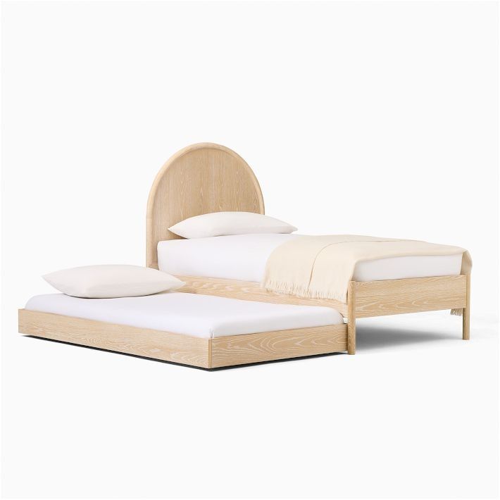 a bed with white sheets and wooden headboard on it's sides, in front of a white background