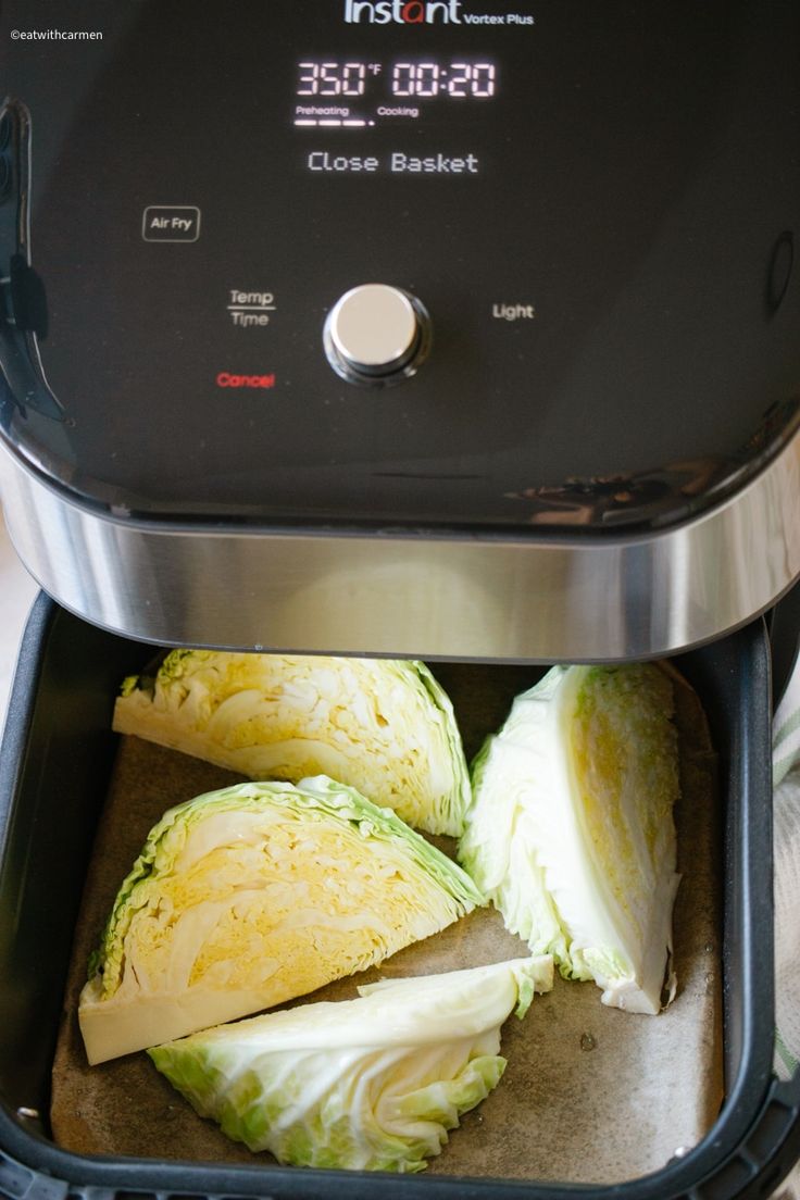 an open air fryer filled with sliced cabbage