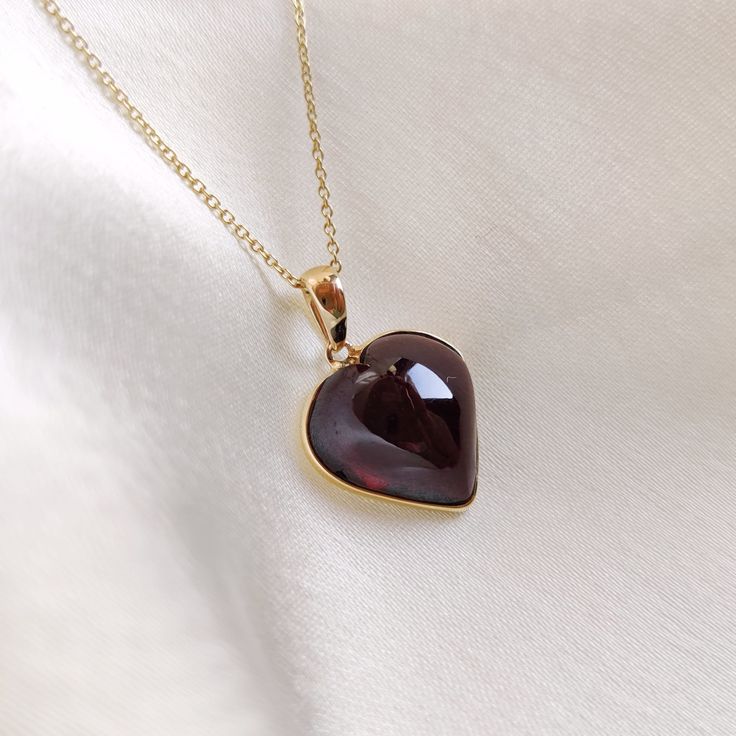 This stunning pendant is set in 14K Solid Yellow Gold with Natural Garnet with utmost precision. It is an unique gemstone pendant for nearly every occasion and is completely hassle-free jewelry. ITEM DETAILS * Gem: Garnet * Gem Size: 14X14mm * Gem Shape: Heart * Gem Weight: 11.61 carats * Gold Purity: 14KT  * Gold Weight: 0.59 gram * Total Weight of the Pendant: 2.91 gram The Gold purity is guaranteed and it comes with authentic 14KT gold hallmark. Since my items are handmade, they are absolutely nickel and lead free. CUSTOMIZATION * Gemstone customization is available and it can be substituted with a gem of your choice. Kindly message me for the same. PACKAGING * The Pendant comes with layers of safe and secure wrapping along with Free handmade jewelry box with every purchase. ➡️Head to t Fine Jewelry Heart Necklace With Polished Finish, Classic Gemstone Necklaces For Valentine's Day, Classic Gemstone Necklace For Valentine's Day, Red Polished Jewelry For Valentine's Day, Formal Gemstone Heart Necklace For Valentine's Day, Classic Amber Necklace As Gift, Classic Amber Necklace For Gift, Classic Amber Necklace Gift, Valentine's Day Formal Heart Gemstone Necklace