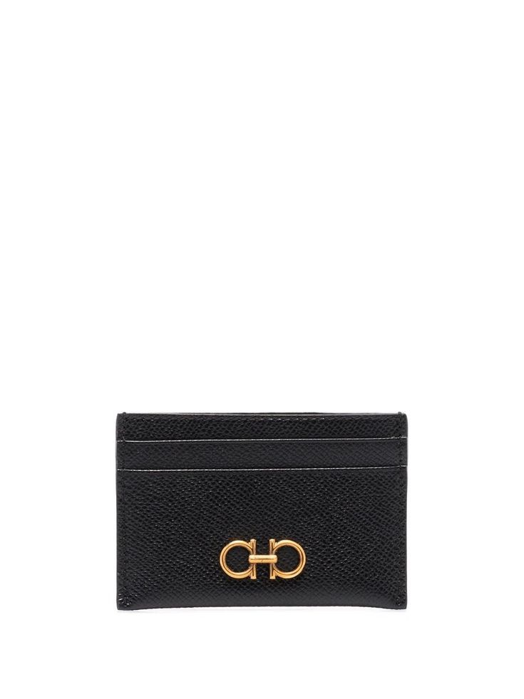 Sleek and sophisticated, this black cardholder promises a blend of luxury and practicality that elevates your daily essentials. Crafted from 100% genuine leather, it's a timeless piece with a contemporary twist. The perfect accessory to slip into your pocket, it's not just a cardholder, but a statement of style. Size: UNICA, a perfect fit for all your cards Color: BLACK (NERO), adds a touch of elegance and versatility Composition: 100% LEATHER, providing durability and a premium feel | Ferragamo Ferragamo Wallet, Leather Card Case, Leather Card Holder, Black Card, Ferragamo Shoes, Black Wallet, Card Holder Leather, Embossed Logo, Salvatore Ferragamo