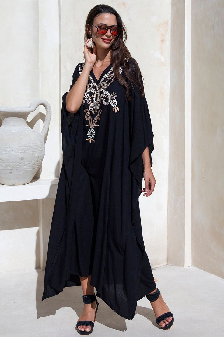 Add a tribal twist to your beach time in this black and gold summer maxi swimwear cover up. Zigzag embroidery adds a spicy accent to this long beach caftan, with a casual vacation vibe and a loose flowy fit that works beautifully on plus sizes. It offers great sun coverage, and is so easy to wear for cruises, lounging, vacation or relaxing days at the beach. Back From Bali is dedicated to creating beautiful, quality clothing with a heart. All of our items are crafted, sewn and painted by hand in Bali, by local artists and women who own small home businesses. For over 20 years, we have nurtured fair, honest and caring relationships with our artisans and their families – so you can feel as good about wearing our products as they feel about making them. Make waves in this black summer maxi sw Grey Swimsuit, Beach Poncho, Beach Caftan, Loungewear Dresses, Make Waves, Print Kimonos, Summer Maxi, Tie Dye Dress, Dyed Dress