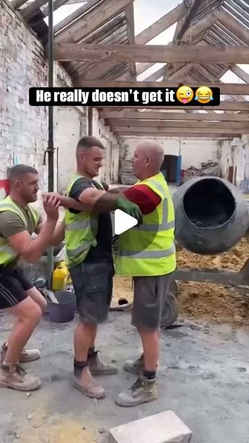 three men in safety vests are talking to each other