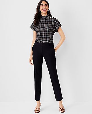 Elevate your wardrobe with the sleek sophistication of Ann Taylor's The Eva Ankle Pant. Perfectly tailored to flatter your figure, these pants feature a slim leg that gracefully grazes the ankle, creating a polished and contemporary silhouette.

- Size: 18
- Color: Black
- Gender: Female
- Material: 92% Cotton, 8% Spandex
- Fit: Tailored and fitted
- Length: Hits at ankle, 27" inseam with 14 1/2" leg opening
- Rise: Mid rise, sits 2 1/4" below natural waist
- Closure: Front zip with hook-and-bar Lean Legs, Tan Woman, Knitted Suit, Tall Pants, Petite Pants, Ankle Pants, Navy Women, Slim Legs, Polished Look