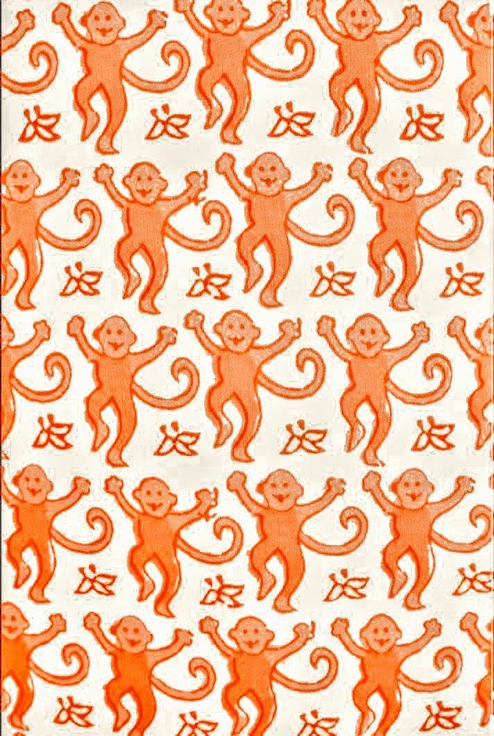 an orange and white pattern with monkeys on it