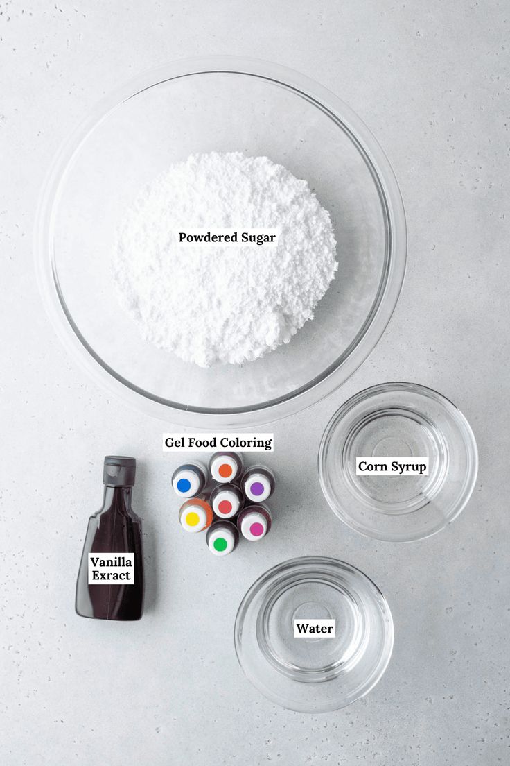 ingredients to make homemade sugar in bowls on a white surface with the words, powdered sugar, gel food coloring, and condiments