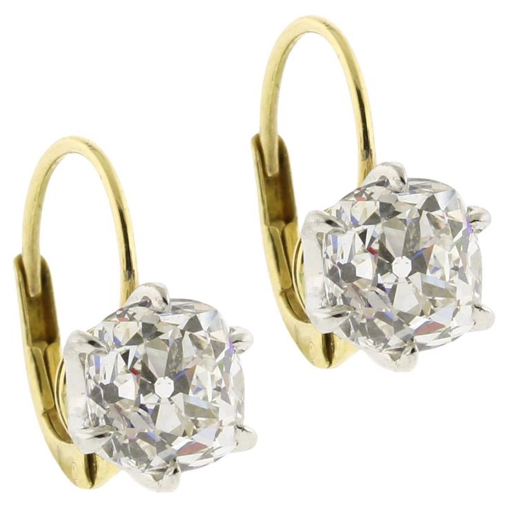 Indulge in the allure of timeless elegance with these exquisite Old Mine Cut Diamond Earrings. Featuring two stunning diamonds weighing 1.66 carats and 1.65 carats respectively, for a total of 3.31 carats, these earrings capture the enchanting brilliance of a bygone era. Each diamond, with a captivating H color and clarity ranging from VS1 to SI1, is securely set in a classic 6-prong setting that enhances its unique sparkle and fire. The old mine cut, known for its charming, slightly irregular s Luxury Vintage Earrings With Single Cut Diamonds, Luxury Oval Diamond Earrings For Formal Events, Luxury Oval Diamond Earrings For Formal Occasions, Luxury Formal Earrings With Single Cut Diamonds, Luxury Hallmarked Diamond Earrings For Formal Occasions, Luxury Formal Diamond Earrings With Brilliant Cut, Luxury Diamond Earrings With Brilliant Cut For Formal Events, Luxury Diamond Earrings With Brilliant Cut For Formal Occasions, Luxury Platinum Diamond Earrings Hallmarked