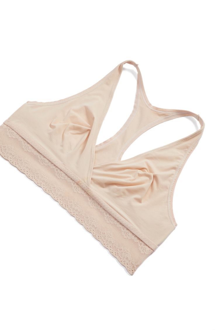 Designed to move with you from pregnancy and beyond, this minimalist wireless bra features a slim racerback and stretchy, nursing-friendly surplice cups. Slips on over head Plunging neck Lined 62% nylon, 38% spandex; 85% nylon, 15% spandex Hand wash, line dry Imported Stretch Nursing-friendly Bra, Pink Nursing Bra With Built-in Stretch, Stretch Pink Nursing Bra With Built-in Bra, Pink Stretch Nursing Bra With Built-in Bra, Supportive Nursing Bra With Built-in Bra For Everyday, Feminine Seamless Full Coverage Nursing Bra, Everyday Fitted Seamless Nursing Bra, Stretch Nursing Bra With Light Support For Relaxation, Fitted Nursing Bra For Everyday