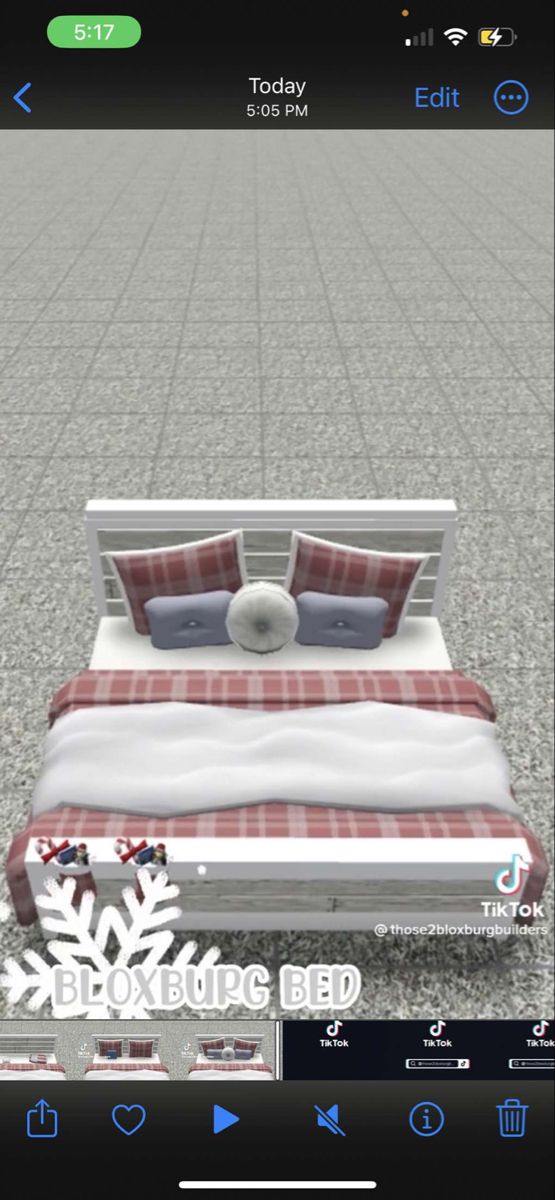 the bed is made up with red and white sheets