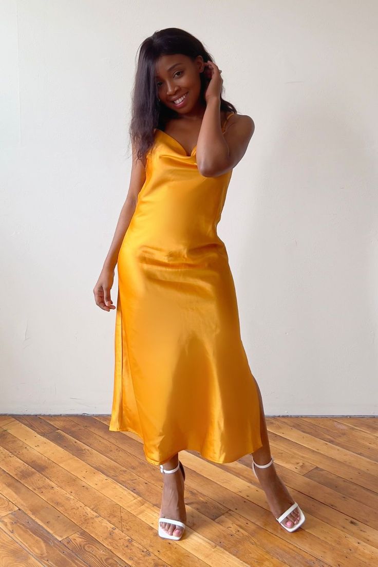 Looking for the perfect classy dress that will have you shining bright at your next event? This gold slip dress outfit offers a touch of glamour for any occasion. Whether you're pairing this look with sneakers for a causal classy look or wearing as a wedding guest look, this champagne slip dress is a stunning choice to show your feminine and classy side. Click the link to shop this product and make a statement at your next special event. Champagne Slip Dress, Feminine Chic Style, Classy Summer Dress, Gold Slip Dress, Cowl Neck Slip Dress, Slip Dress Outfit, Slip Midi Dress, Spring Outfits Dresses, Elegant Midi Dresses