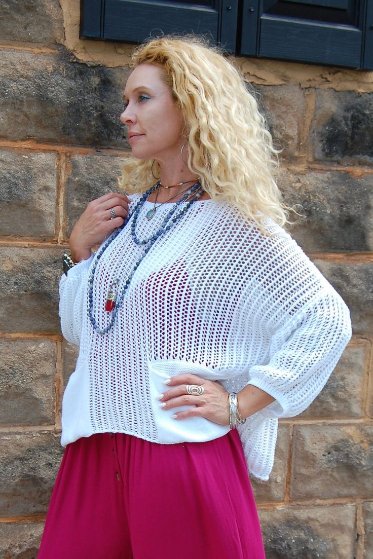 The Atticus Knit Top in White ♡ Product Highlights ♡ • Our Atticus Knit Top in White is the perfect go-to top to add to your closet, and or any on-trend bohemian style outfit! Giving your look a cozy element, this top comes with a stylish crochet detail design, and comes with 2 conveniently placed front pockets. Pair and layer with a trendy kimono, or stylish jacket, our Be Kind Graphic Tee will be sure to become a favorite of your closet! ✁ Contents & Measurements ✁ • This Atticus Knit Top in W Bohemian Chunky Knit Tops For Spring, Bohemian Textured Knit Sweater With Crew Neck, Bohemian Crew Neck Sweater With Textured Knit, Bohemian Sweater With Textured Knit And Crew Neck, Spring Beach Sweater In Chunky Knit, Bohemian Pointelle Knit Top For Fall, Fall Vacation Pointelle Knit Crochet Top, Spring Chunky Knit Beach Sweater, Spring Chunky Knit Sweater For Beach