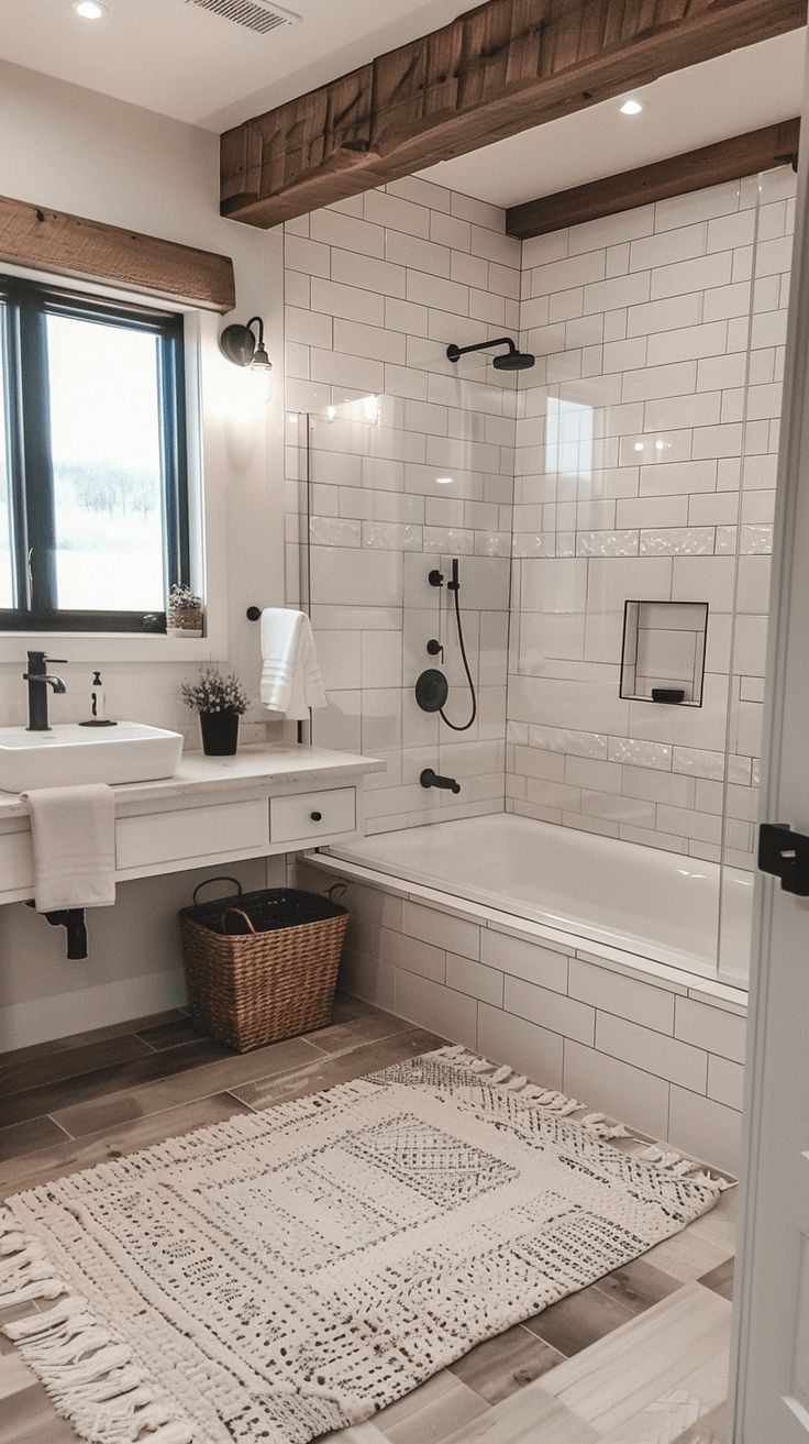 a bathroom with white tile and wood trimming on the walls, floor, and bathtub