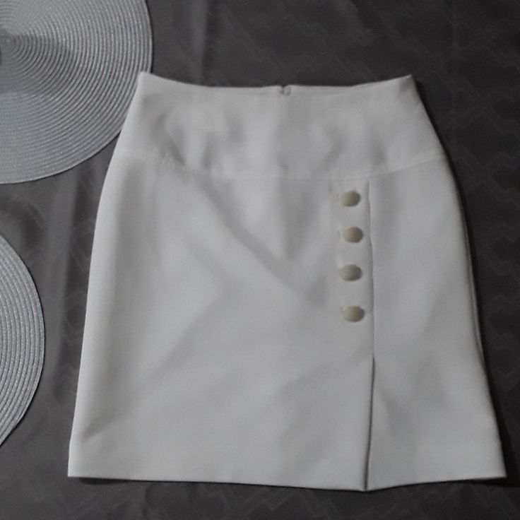 Beautiful Ivory Formal,Linea Fully Lined Skirt Button Detail On Front Tag Says 10,But Is Size 6 No Tags But Never Worn.Bundle To Save I Have Many Items For $10.00 Or Less. Fitted Mini Skirt With Buttons, Elegant Buttoned Mini Skirt For Spring, High Waist Skort With Buttons For Work, Elegant Skirt With Buttons, White Mini Skirt For Formal Occasions, Elegant Short Bottoms With Buttons, Fitted High Waist Mini Skirt With Buttons, Elegant Pencil Skirt With Buttons, Elegant Formal Mini Skirt With Buttons