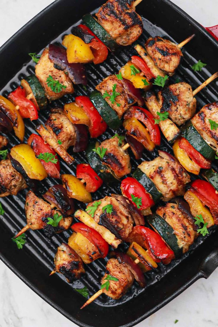 chicken and vegetable kabobs on a grill