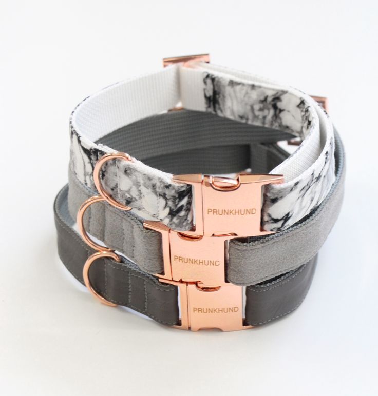 three different colored belts with metal buckles on each one and marbled leather straps