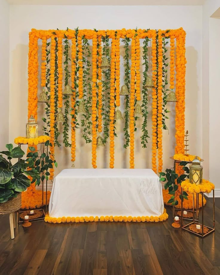 a white table topped with flowers and candles