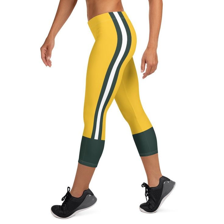 Support the Packers with these uniform capri leggings. These super soft and comfortable Green Bay football uniform leggings won't lose their stretch and provide that support and comfort you love. .: 82% polyester/18% spandex .: Material has a four-way stretch, which means fabric stretches and recovers on the cross and lengthwise grains .: Made with a smooth, comfortable microfiber yarn .: Precision-cut and sewn after printing .: Please note that contact with rough surfaces and velcro fasteners s Sporty Moisture-wicking Activewear For Game Day, Cheerleading Sportswear For Sports Season, Game Day Moisture-wicking Activewear For Sports Season, Moisture-wicking Team-colored Activewear For Sports, Sporty Stretch Leggings For Sports Events, Moisture-wicking Activewear For Cheerleading, Sporty Activewear For Game Day, Moisture-wicking Activewear For Game Day, Sporty Leggings For Sports Events