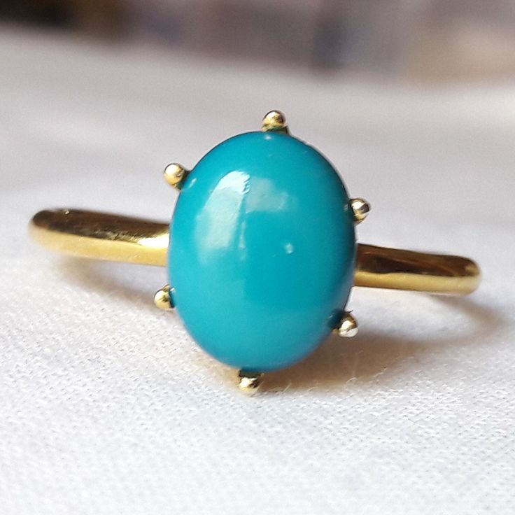 Material  14k Yellow Gold  . Gemstone  Natural Turquoise  . Gemstone Colour  Blue . Gemstone Shape  Oval . Gemstone Size  6x8 MM . birthstone  December  . Cut Grade  Excellent . Style  Art Deco Gold Oval Hallmarked Turquoise Ring, Sterling Silver Turquoise Ring With Yellow Gold Gemstone, Sterling Silver Turquoise Ring In Yellow Gold, Turquoise Gemstone Ring In Yellow Gold Sterling Silver, Gold Oval Turquoise Sterling Silver Ring, Gold Oval Turquoise Ring In Sterling Silver, Oval Gold Turquoise Ring In Sterling Silver, Oval Gold Turquoise Ring Fine Jewelry, Oval Turquoise Cabochon Ring In Yellow Gold