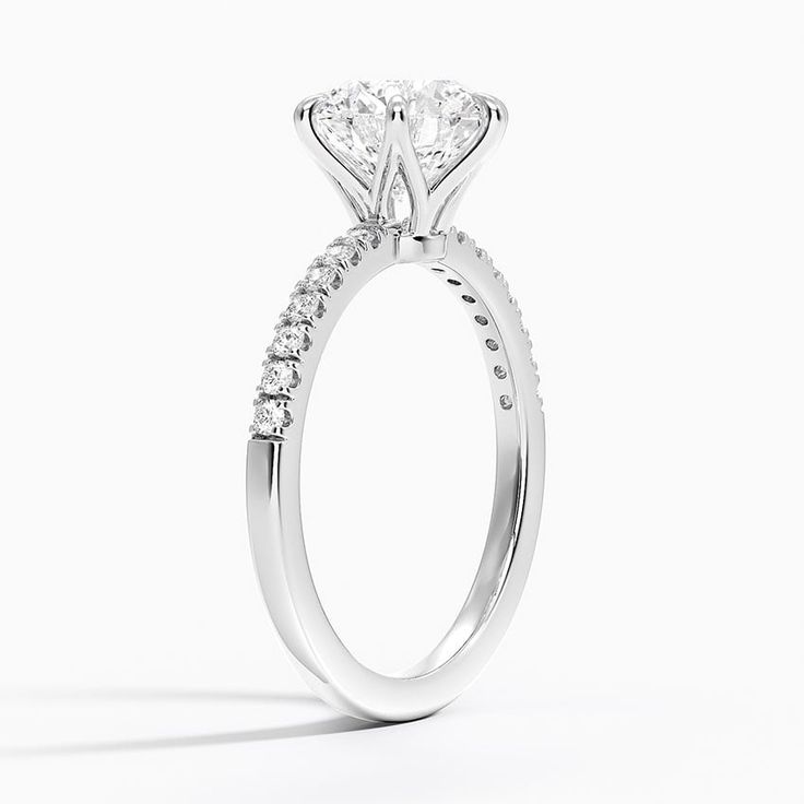 a white gold engagement ring with diamonds on it