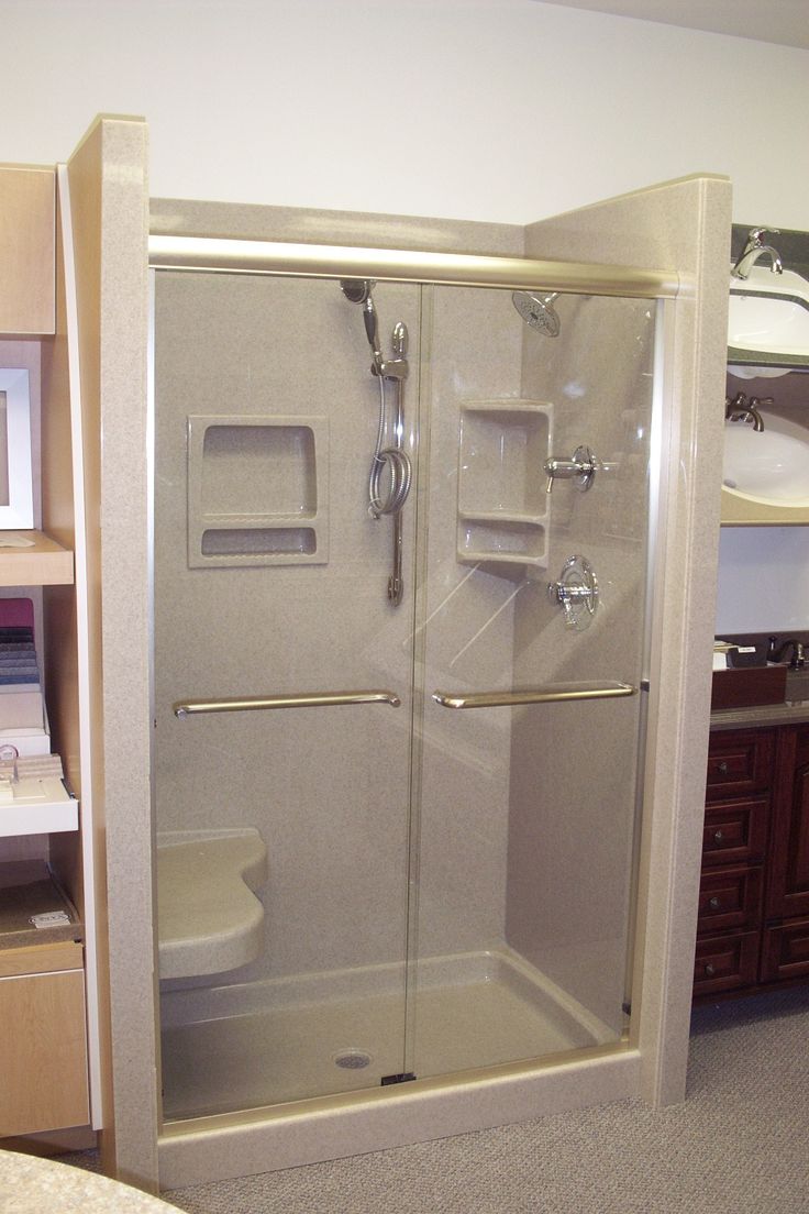 a bathroom with a glass shower door and toilet