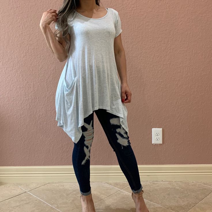 Melange Jersey Princess Line Shark-Bite Tunic Top Featuring Pockets. Non-Sheer. Knit . Lightweight, Super Soft And Comfy. True To Size S (2-4), L ( 10-12) Casual Stretch Tunic For Summer, Casual Tunic Top For Loungewear, Casual Free Size V-neck Tops, Casual V-neck Tunic For Layering, Blue Oversized Casual Tunic, Oversized Blue Casual Tunic, Free Size Short Sleeve Top For Spring, Free Size Casual V-neck Tunic, Spring Casual Tops With Curved Hem