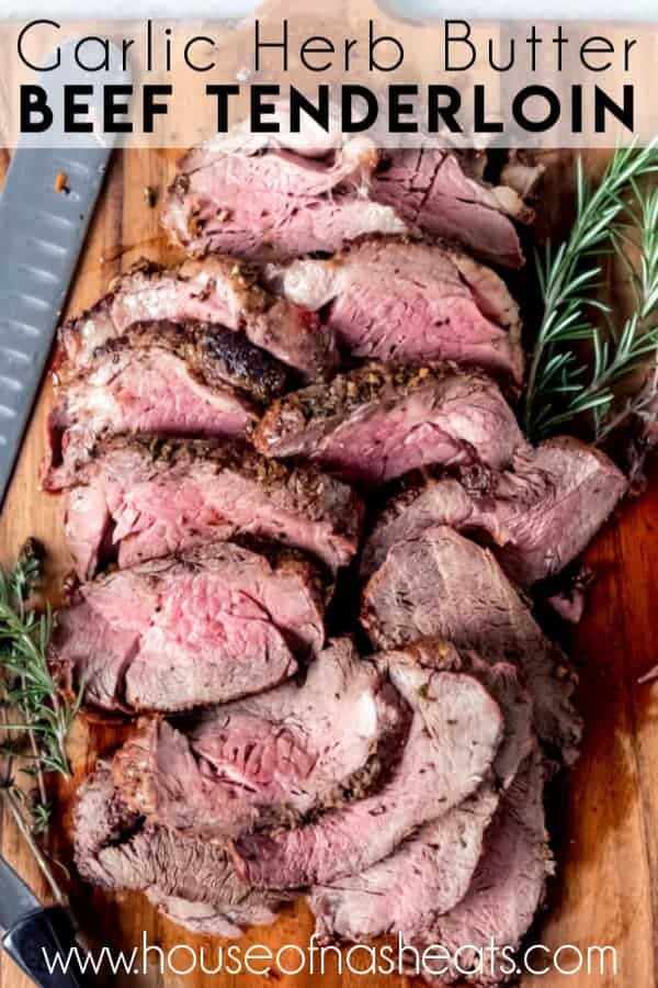 garlic herb butter beef tenderloin on a cutting board