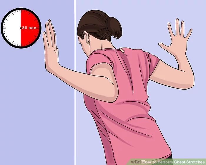 a woman throwing a ball in the air with her hands and arm extended to reach it