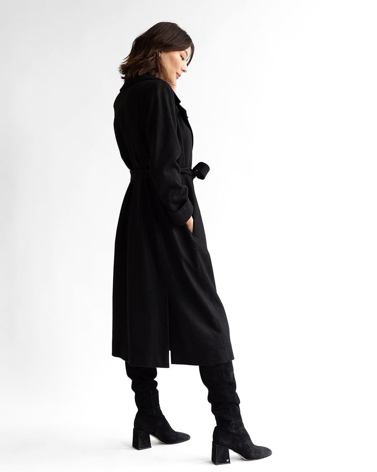 Timeless Long Black Wool Overcoat with a modern twist. Proudly Made in the USA from 100% RWS certified + NATIVA Regen™ domestic wool. Ethically sewn in Chicago, IL. Recommended for temperatures ranging from 5 to 35 degrees Fahrenheit. Fully lined for warmth and quality. Combines style and sustainability. Double back walking vent for mobility. On-seam belt vents for versatile styling options. Deep on-seam pockets for carrying essentials. Single horn snap closure reinforced with magnetic closures Black Fitted Long Sweater Coat, Fitted Black Sweater Coat For Work, Tailored Black Wool Long Coat, Modern Tailored Black Wool Coat, Tailored Black Wool Coat With Long Sleeves, Tailored Black Long Sleeve Wool Coat, Black Wool Long Sweater Coat, Tailored Black Long-sleeve Wool Coat, Tailored Black Wool Coat