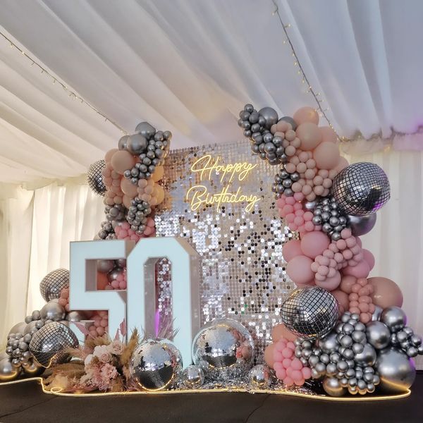 a 50th birthday party with balloons and decorations