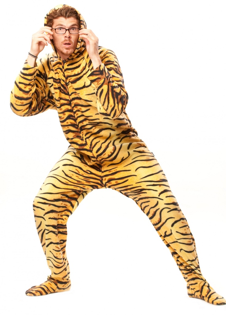 a man in a tiger costume is talking on the phone while holding his hands to his ears