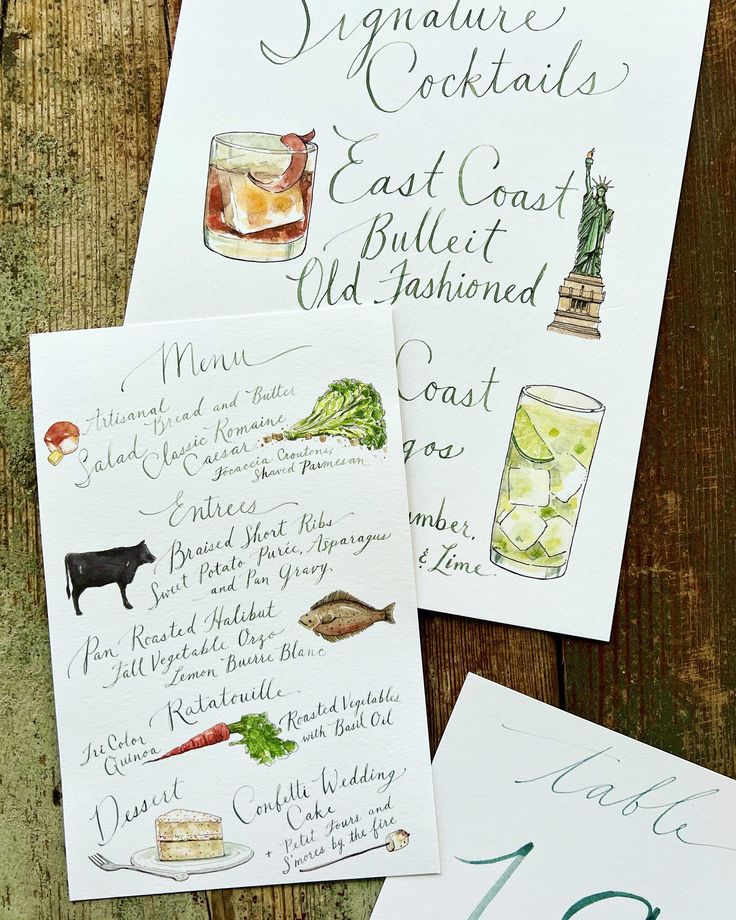 three handwritten cocktail menus on top of a wooden table next to each other