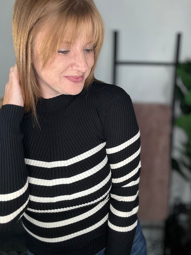 Stay warm in style with our Black And White Stripe Ribbed Sweater. This playful sweater features a trendy green and white stripe design, perfect for any occasion. Made from cozy ribbed material, you'll love the comfort and style this sweater brings to your wardrobe. What more could you ask for?! Material: 50% VISCOSE, 28% POLYESTER, 22% NYLON Sizing: Small: Sizes 4-6 Medium: Sizes 8-10 Large: 12-14 Model Info: Opal: Size 8, 36DD, 5’7 (true to size M wearing a M) Trendy Striped Sweater With Ribbed Cuffs, Trendy White Ribbed Sweater, Striped Ribbed Crew Neck Sweater, Chic Striped Sweater With Ribbed Collar, Trendy Striped Cropped Sweater, Trendy Striped Stretch Sweater, Striped Long Sleeve Ribbed Sweater, Trendy White Sweater With Ribbed Collar, Striped Knit Turtleneck Top