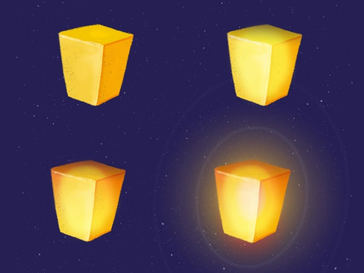 three yellow cubes are glowing in the dark