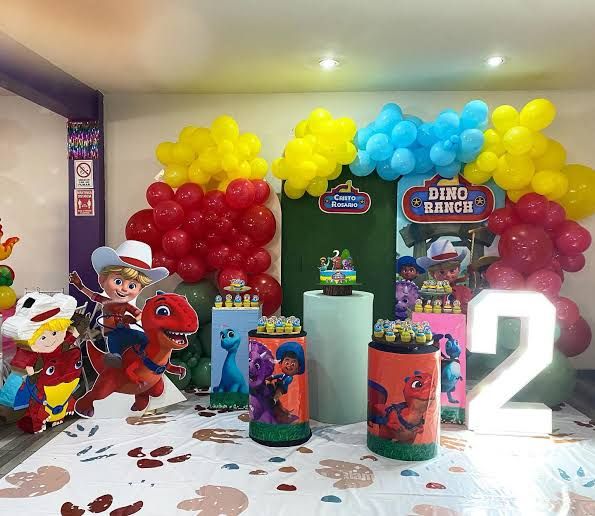 the birthday party is decorated with balloons, toys and other items for children's birthdays