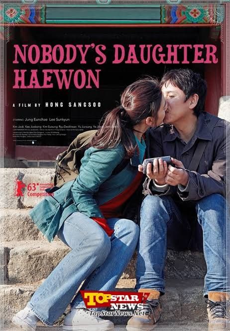 a man and woman kissing while sitting on the steps in front of a sign that says nobody's daughter hawon