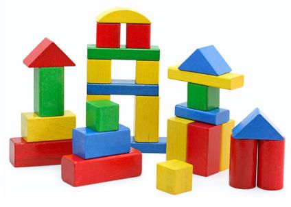 colorful wooden blocks and shapes on a white background