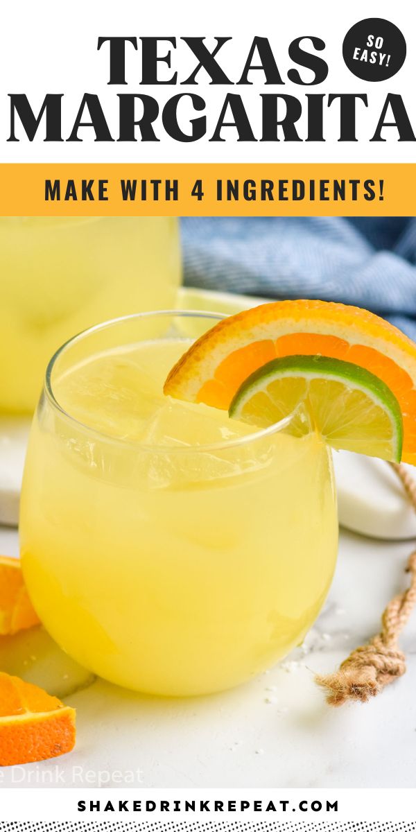 a close up of a drink in a glass with orange slices