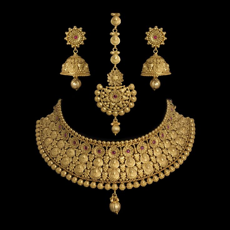 India Bridal Gold Plated Choker Necklace, a dazzling piece of Temple Jewelry. This Choker Necklace exudes timeless elegance and is ideal for weddings and special occasions. Crafted in the South Indian tradition, it reflects the rich heritage of Temple Jewelry. Adorn yourself with the intricate designs of this Temple Necklace Set, perfect for making a statement.  *𝐏𝐑𝐎𝐃𝐔𝐂𝐓 𝐃𝐄𝐓𝐀𝐈𝐋* * Material: Brass * Plating: Gold Plated * Stone: Semi Precious Stones. *𝐃𝐈𝐌𝐄𝐍𝐒𝐈𝐎𝐍𝐒* * Necklace Gold Jewelry Sets For Wedding, Elegant Yellow Gold Necklace For Marriage, Gold Hand Set Bridal Accessories For Reception, Gold Hand-set Bridal Accessories For Reception, Gold Bridal Necklace With Elegant Design For Wedding, Elegant Gold Bridal Accessories With Intricate Design, Classic Wedding Necklace With Intricate Design, Classic Wedding Necklaces With Intricate Design, Hand Set Yellow Gold Jewelry Sets For Wedding