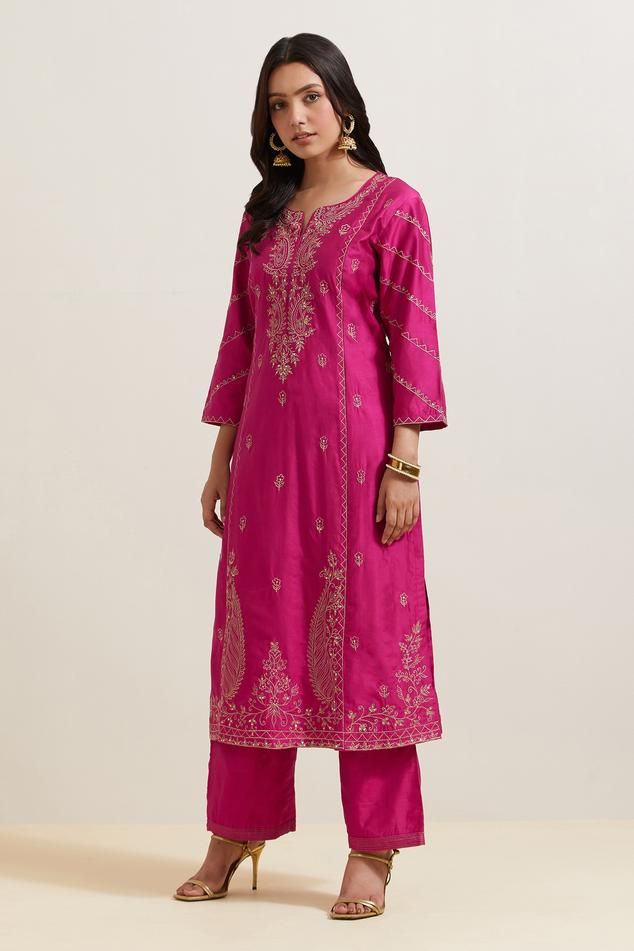 Pink natural weaves chanderi silk kurta with contrast paisley and floral embroidery. Comes with pant and shimmer organza dupatta.
Components: 3
Pattern: Embroidered
Type Of Work: Floral and Paisley
Neckline: Notched
Sleeve Type: Three Quarter
Fabric: Chanderi Silk, Shimmer Organza
Color: Pink
Other Details: 
Embroidered hem pant
Fringed border dupatta
Occasion: Puja - Aza Fashions Embroidered Hem, Kurta Set For Women, Natural Weave, Silk Kurta, How To Hem Pants, Organza Dupatta, Pink Paisley, Kurta Set, Womens Tunics