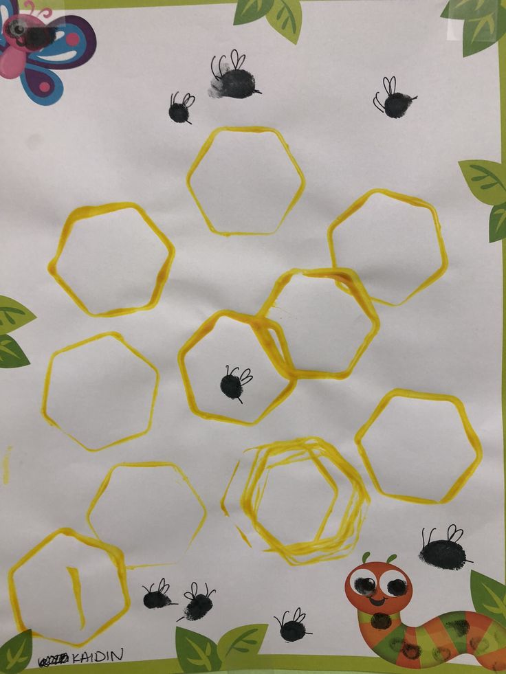 the bees and honeycombs are drawn on paper with yellow crayon tape